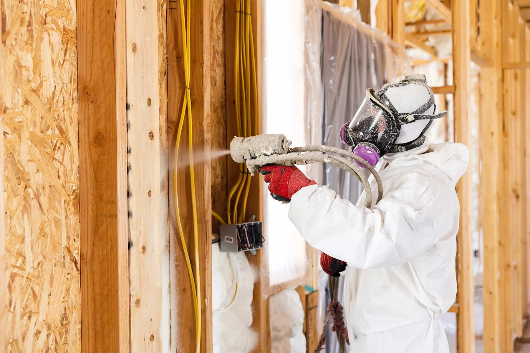 Spray foam being applied to a roof deck
